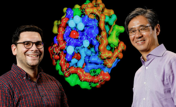 Assistant Professor Kostas Chronis (L) of the Department of Biochemistry and Molecular Genetics and Richard and Loan Hill Professor Jie Liang of the Department of Biomedical Engineering show off research from their DOE INCITE grant.