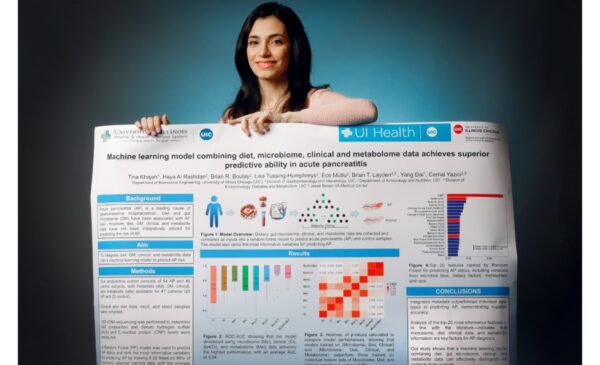 BME PhD student Tina Khajeh shows off her poster for the upcoming conference